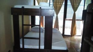 Voodi või voodid majutusasutuse Cabinas surf Arribadas toas