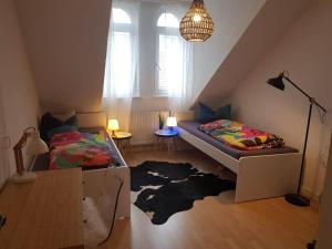 a bedroom with a bed and a rug on the floor at Wohngemeinschaft in der Citycenter in Karlsruhe