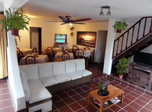 a living room with a couch and a table at Hotel La Casona in La Paloma
