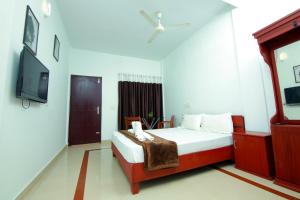 Cama o camas de una habitación en Shalom Beach Residency