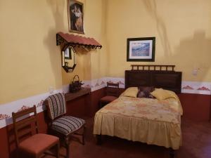 Voodi või voodid majutusasutuse Ex-Hacienda San Buenaventura toas
