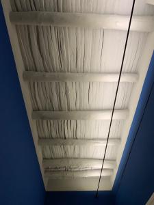 a white ceiling with a long pole in it at PrimoPianoPosillipo in Naples