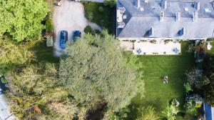 an overhead view of a house with a car in the yard at Clos de Bellefontaine B&B in Bayeux