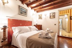 En eller flere senge i et værelse på Residenza Contessa Costanza