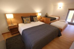 En eller flere senge i et værelse på Casa da Fonte Sagrada