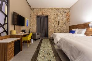 A bed or beds in a room at Casa de la Audiencia