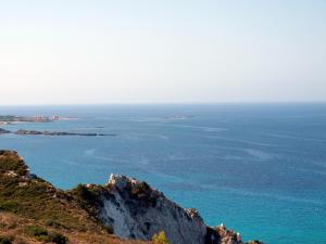 a view of the ocean from atop a mountain at Niko Studios in Lassi