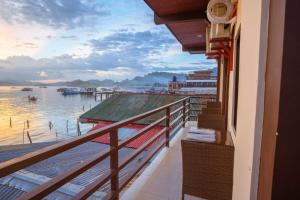 a balcony of a building with a view of the water at Argamosa Bayside Inn in Coron