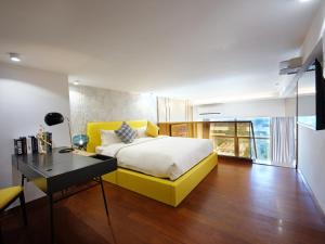 Giường trong phòng chung tại Royal Star Apartment(Guangzhou Central City Branch)