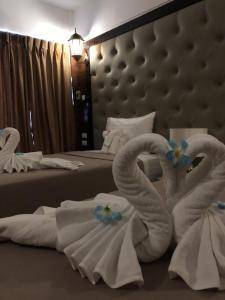 Postel nebo postele na pokoji v ubytování SUDYOD HOTEL