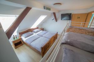 Ένα ή περισσότερα κρεβάτια σε δωμάτιο στο Hostel Sonce