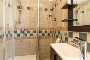 a bathroom with a shower and a sink at Apartments DDD in Baška +51 photos