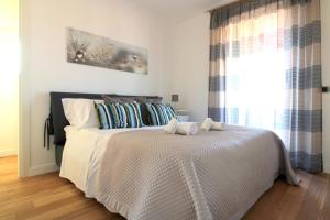 Ένα ή περισσότερα κρεβάτια σε δωμάτιο στο Suite Delicia Apartment - Appartamento con Terrazza