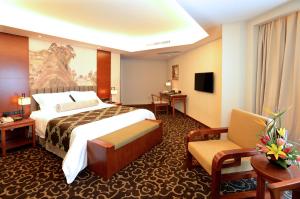 Postel nebo postele na pokoji v ubytování Xiyuan Hotel