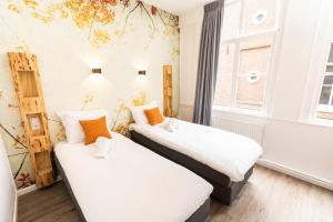 Postel nebo postele na pokoji v ubytování Hotel Pagi