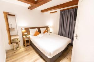 Postel nebo postele na pokoji v ubytování Hotel Pagi