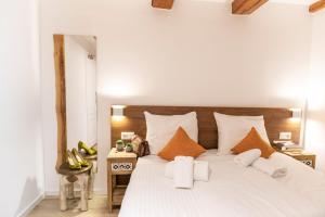 Postel nebo postele na pokoji v ubytování Hotel Pagi