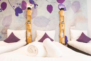 Postel nebo postele na pokoji v ubytování Hotel Pagi