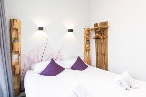 Postel nebo postele na pokoji v ubytování Hotel Pagi