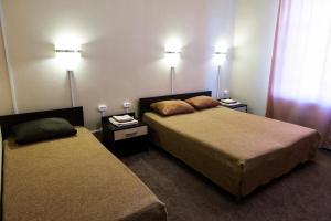 Кровать или кровати в номере Hotel Volga