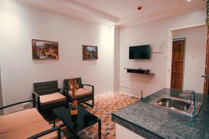 TV a/nebo společenská místnost v ubytování Kingswick Residences & Lodge