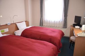 Giường trong phòng chung tại Hotel Ermou Regency
