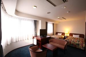 Giường trong phòng chung tại Hotel Ermou Regency