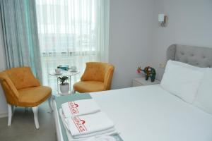 A bed or beds in a room at Nar Palace