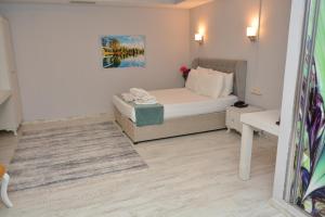 A bed or beds in a room at Nar Palace
