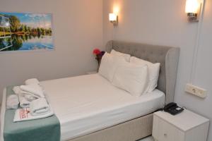 A bed or beds in a room at Nar Palace