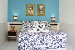 Cama ou camas em um quarto em Porto Bahia Hotel