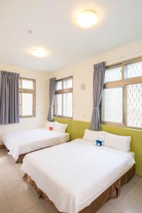 Postel nebo postele na pokoji v ubytování Happiness B&B