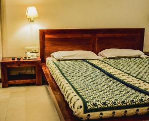 Postel nebo postele na pokoji v ubytování Atithi Guest House