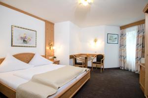Posteľ alebo postele v izbe v ubytovaní Hotel Garni Subretta