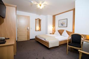 Posteľ alebo postele v izbe v ubytovaní Hotel Garni Subretta