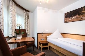 Posteľ alebo postele v izbe v ubytovaní Hotel Garni Subretta