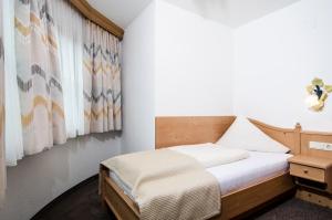 Posteľ alebo postele v izbe v ubytovaní Hotel Garni Subretta