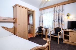 Posteľ alebo postele v izbe v ubytovaní Hotel Garni Subretta