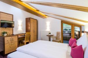 Posteľ alebo postele v izbe v ubytovaní Hotel Garni Subretta