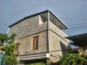 a building with a window on the side of it at Georgian Hosts Tbilisi in Tbilisi City