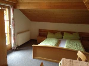 a bedroom with a large bed in a cabin at Haus Gletscherblick in Längenfeld