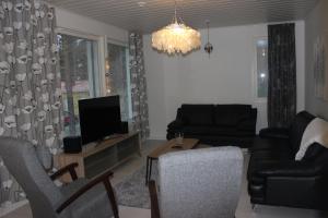 Ruang duduk di Majoituspalvelu Nurmi Apartment Oksapolku 2 B Deluxe Huoneisto 103m2