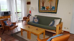 a living room with a couch and a coffee table at Appartement Hoeve Espewey - Leisure only in Hombourg