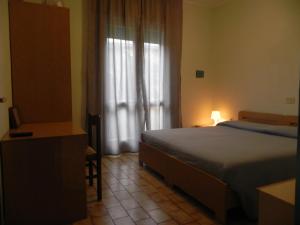 Postel nebo postele na pokoji v ubytování Hotel Antonella