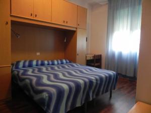 Postel nebo postele na pokoji v ubytování Hotel Antonella