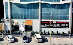 a group of cars parked in front of a building at Grandeur East in Al Khobar
