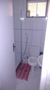 a bathroom with a toilet and a window at Recanto da natureza in Sana +12 photos