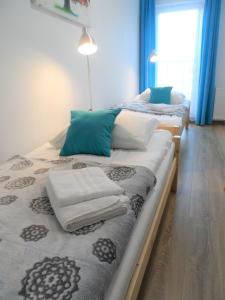 Posteľ alebo postele v izbe v ubytovaní Apartament Dmowskiego - Kępa Mieszczańska