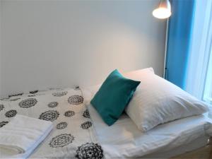 Posteľ alebo postele v izbe v ubytovaní Apartament Dmowskiego - Kępa Mieszczańska