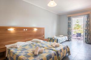 Postel nebo postele na pokoji v ubytování Dados Hotel